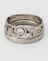 'Fine Loop Ring' with 7 diamonds and a wedding band all in 18K white gold